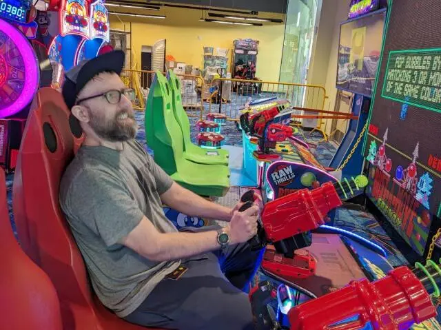 Ryan Chaplin playing an arcade game