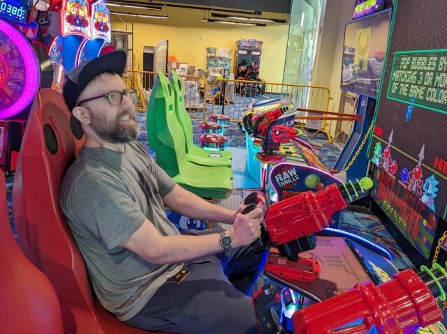 Ryan Chaplin playing an arcade game