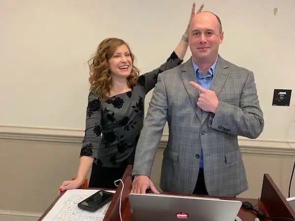 Raxis COO and CTO before a tabletop